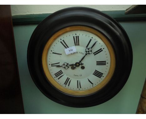 Circular vineyard clock marked 'Chauvin Saint Lo' with enamel face, Roman Numerals and ebonised surround 