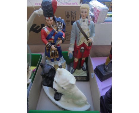 3 figures being ceramic Black and White Scotch whisky with dogs, figure of a Highlander being Prince Charlie with 'Drambuie' 