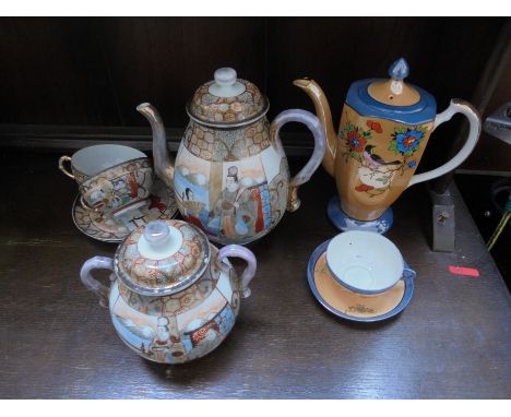 Japanese decorated tea pot with scene incorporating man and woman with matching lidded pot for tea and 2 further matching cup