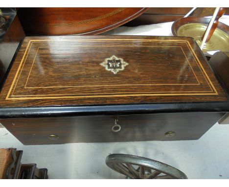 Beautiful rosewood ebonised cylinder music box with inlaid mahogany mother of pearl to top having ratched style workings and 