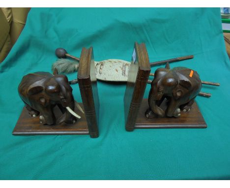 2 wooden bookends of elephant design, possibly 1930's and additional African tribal Art of spear shield, clubs etc. for wall 
