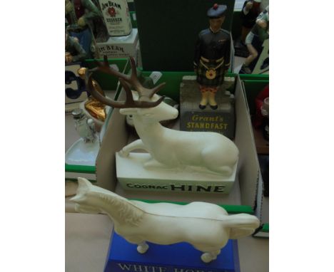 4 figures, a white horse with White Horse Scotch Whisky to base, white figure of Stag stating 'Cognac Hind', Scottish Soldier