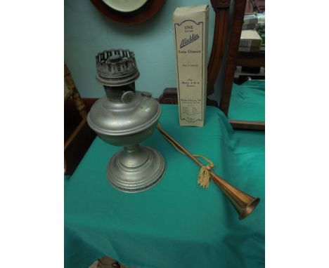 Old metal oil lamp base with Aladdin lamp chimney in original box and decorative copper horn