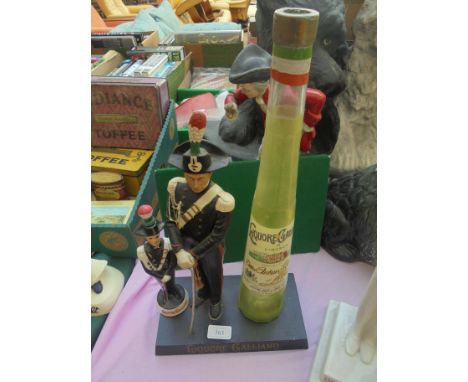 Italian soldier in dress uniform with large liqueur Galliano bottle to side and to base 'Liqueur Galliano' a separate ceramic