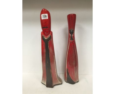 A David Sharp Rye Pottery "Bishop" red glazed chess piece candlestick together with a "Queen" candlestick (39.5cm and 38cm).