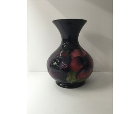 A William Moorcroft Pottery vase decorated in the Clematis pattern, incised "W. Moorcroft Potter to H. M. The Queen" and pain
