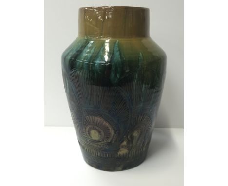 A Linthorpe Art Pottery  vase, designed by Christopher Dresser, decorated with incised Mollusc shape patterns in tones of gre