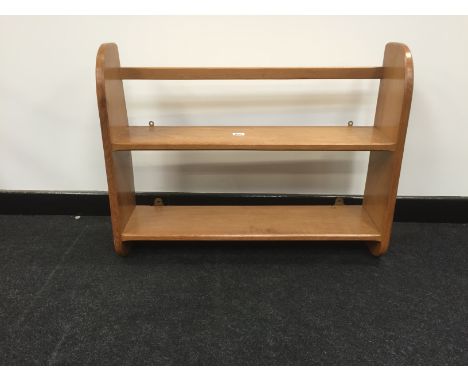 An Alan 'Acornman' Grainger two tier light oak wall shelf with Adzed sides.