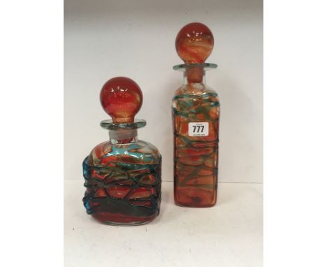 A Mdina Art Glass decanter decorated in tones of blue and orange together with a matching squat glass decanter.
