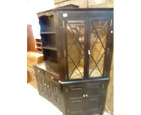 Dark stained oak welsh dresser, two drawers over two cupboards, two shelf back and a matching double glazed door corner unit,