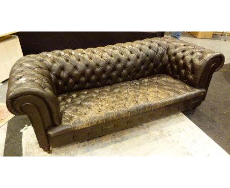 Vintage brown leather Chesterfield style settee, with button back and seat and rolled arms, L: 210 cm