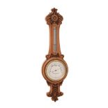 AN UNUSUAL VICTORIAN CARVED BOXWOOD MINIATURE ANEROID WHEEL BAROMETER
