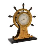 Y A VICTORIAN GILT BRASS AND EBONY ANEROID ‘SHIPS WHEEL’ MANTEL BAROMETER
