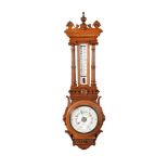 A VICTORIAN CARVED OAK AND WALNUT ANEROID WHEEL BAROMETER