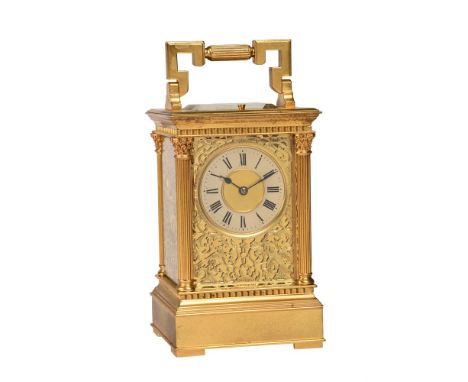 A FRENCH GILT ANGLAISE RICHE CASED REPEATING CARRIAGE CLOCK WITH FINE ENGRAVED FRETWORK PANELSE. MAURICE AND COMPANY, PARIS, 