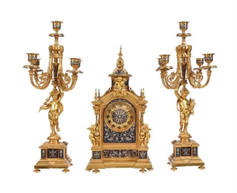 A FINE FRENCH BELLE EPOQUE GILT BRASS AND CHAMPLEVE ENAMELLED MANTEL CLOCK GARNITURETHE MOVEMENT STAMPED FOR 'CHLES MT', PARI