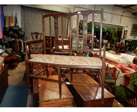 An Edwardian Mahogany light and dark-wood strung Double Seat with inlaid details to the backs and having open arms, the seat 