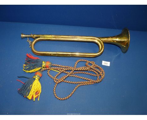 A military Bugle with plaited multi-colour tasselled with rope, makers Mayers & Harrison, 1961.