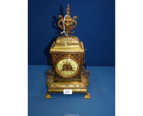 A heavy pierced work Brass cased Mantel/Bracket Clock, the face having a cream chapter ring (slightly damaged) with Roman num