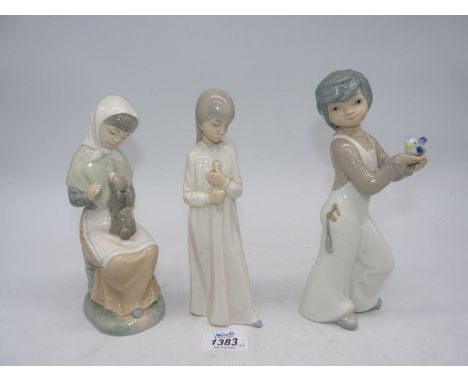 Two Nao figures to include: a girl stroking a rabbit and another and a Spanish cascades figure of a boy holding a bird.