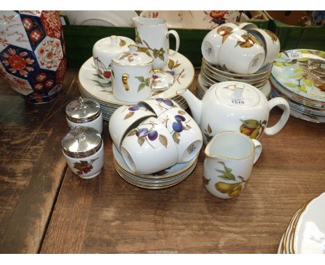 A Royal Worcester "Evesham" part tea service to include: eight cups, nine saucers, six tea plates, two jugs, two pots, two eg