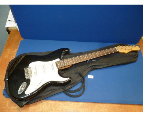 A cased "Stagg" electric guitar.