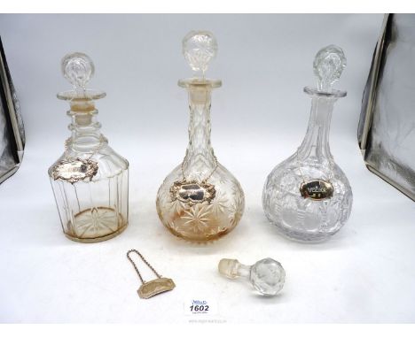 Three decanters and four chain labels 'Vodka', 'Rum', 'Rye' and 'Sherry'.