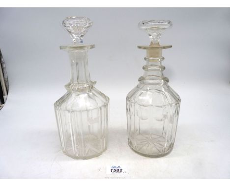 Two Georgian decanters, one having triple ring neck decanter with mushroom stopper with lobed faceted body, the other with he