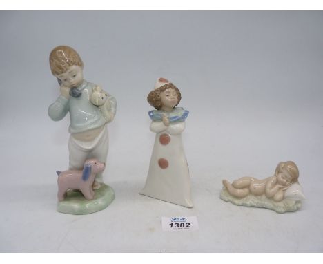 Two Nao figures, one of boy holding a Teddy, another of a Pierrot girl plus a Lladro figure of a young boy sleeping.