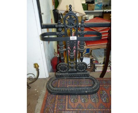 An ornate cast iron Umbrella/ stick stand, 24" tall.