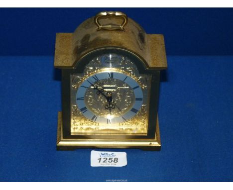 A domed top brass cased 'Tempus Fuoile' Carriage clock by Swiza, back a/f.