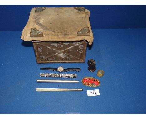 A metal army Ammunition box with canvas top, 7" square x 5" high, plus contents including Egyptian style brooch, Timex watch,