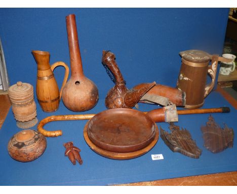 A quantity of treen to include: a Malacca fruit bowl, Gourd pot/vase, a pair of Balinese wall carved heads, walking stick, et