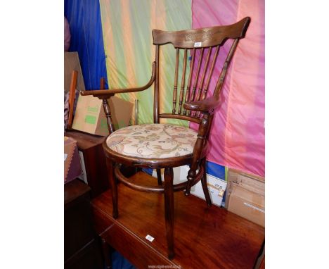An arts and crafts type bentwood framed, open armed Elbow Chair standing on turned legs and having a turned stick back and a 