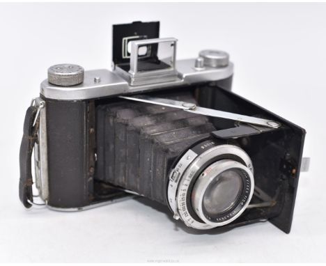 An Ensign Selfix 820 folding bellows roll film camera having a Ross of London 105mm Xpres f/3.8 lens and Epsilon shutter.