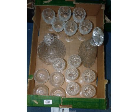 A quantity of cut glass including Thomas Webb elliptical shaped decanter, ships decanter, wine glasses and brandy balloons.