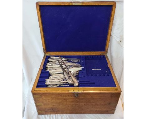 A late Victorian oak multi-tray fitted canteen with part contents of silver plated cutlery and silver handled pistol grip car