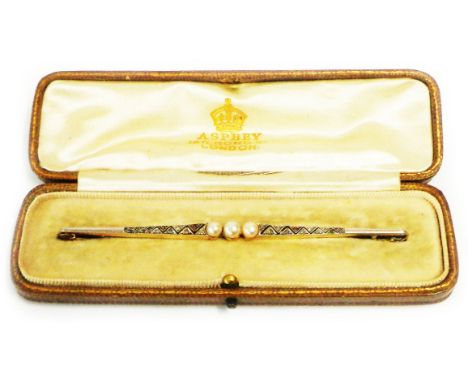 A 10cm 1930's Asprey of London retailed bi-metal bar brooch, set with three central pearls and flanking rose diamonds in a pi
