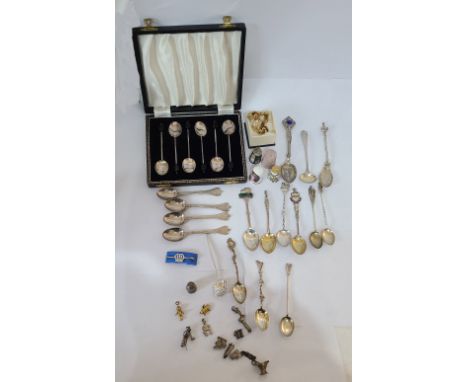 A bag containing a set of four Britannia silver dog nose teaspoons - London 1929, two Irish harp decorated souvenir spoons, f
