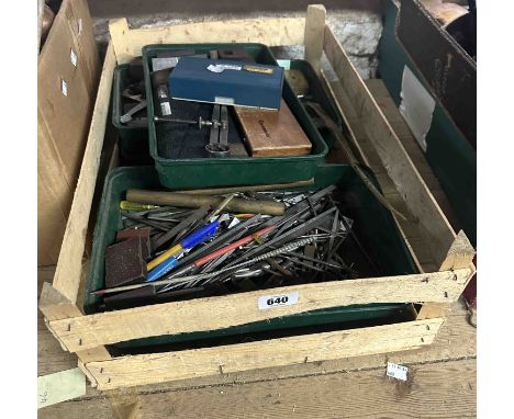 A wooden crate containing five trays of engineering tools