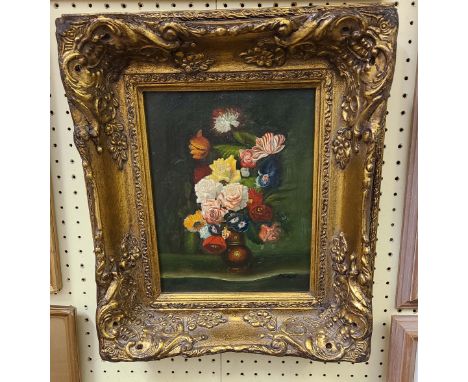 An ornate gilt framed reproduction hand finished coloured print on canvas still life with vase of flowers on a surface