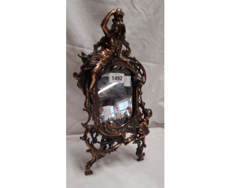 A coppered spelter ornate Rococo style dressing table mirror 'Beatrice, N 1007 A', with female figure and putto decoration an