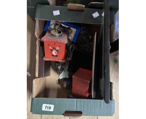 A box containing collectable items including serpentine rock samples, marble carpet bowl, a small vintage coffee grinder, etc