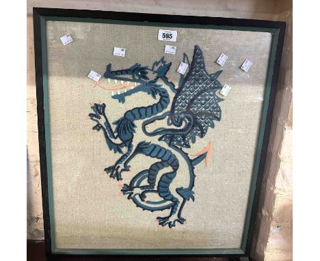A wooden fire screen inset with an embroidered dragon panel