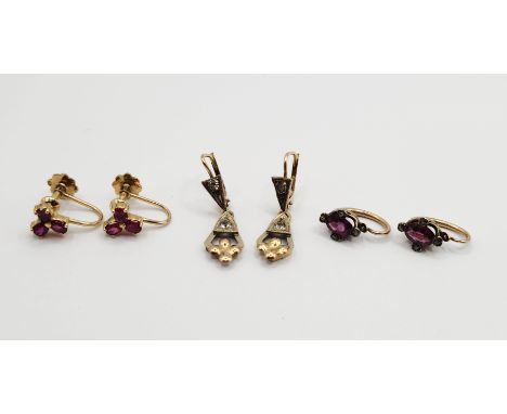 A pair of marked 585 yellow metal triple ruby earrings - sold with a pair of 750 and white paste drop earrings and another pa