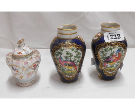 A 19th Century Berlin porcelain pounce pot and lid with hand painted floral decoration and gilt Rococo scrolling - sold with 