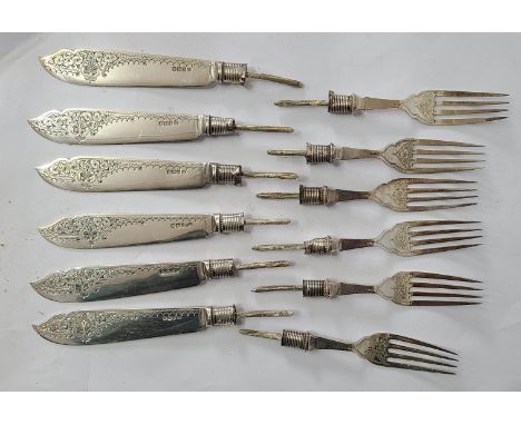 Six each silver fish knife blades and fork tines with silver collars - ivory handles removed
