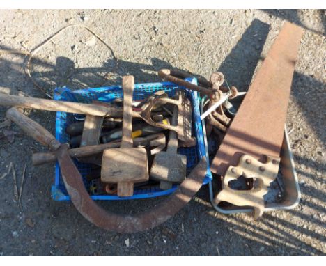 A crate containing a quantity of old tools including handsaw, screwdriver, etc. - rusted