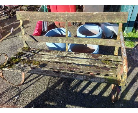 A 1.2m vintage cast iron two seater garden bench with scroll arms