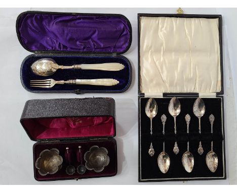 A cased set of six silver coffee spoons with bird and nest decorated terminals - sold with a cased pair of small silver lobed